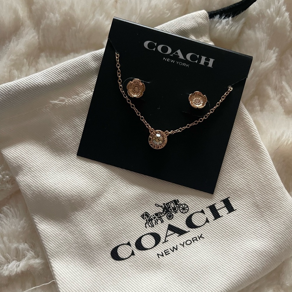 New! Coach rose gold costume earrings and necklace set.